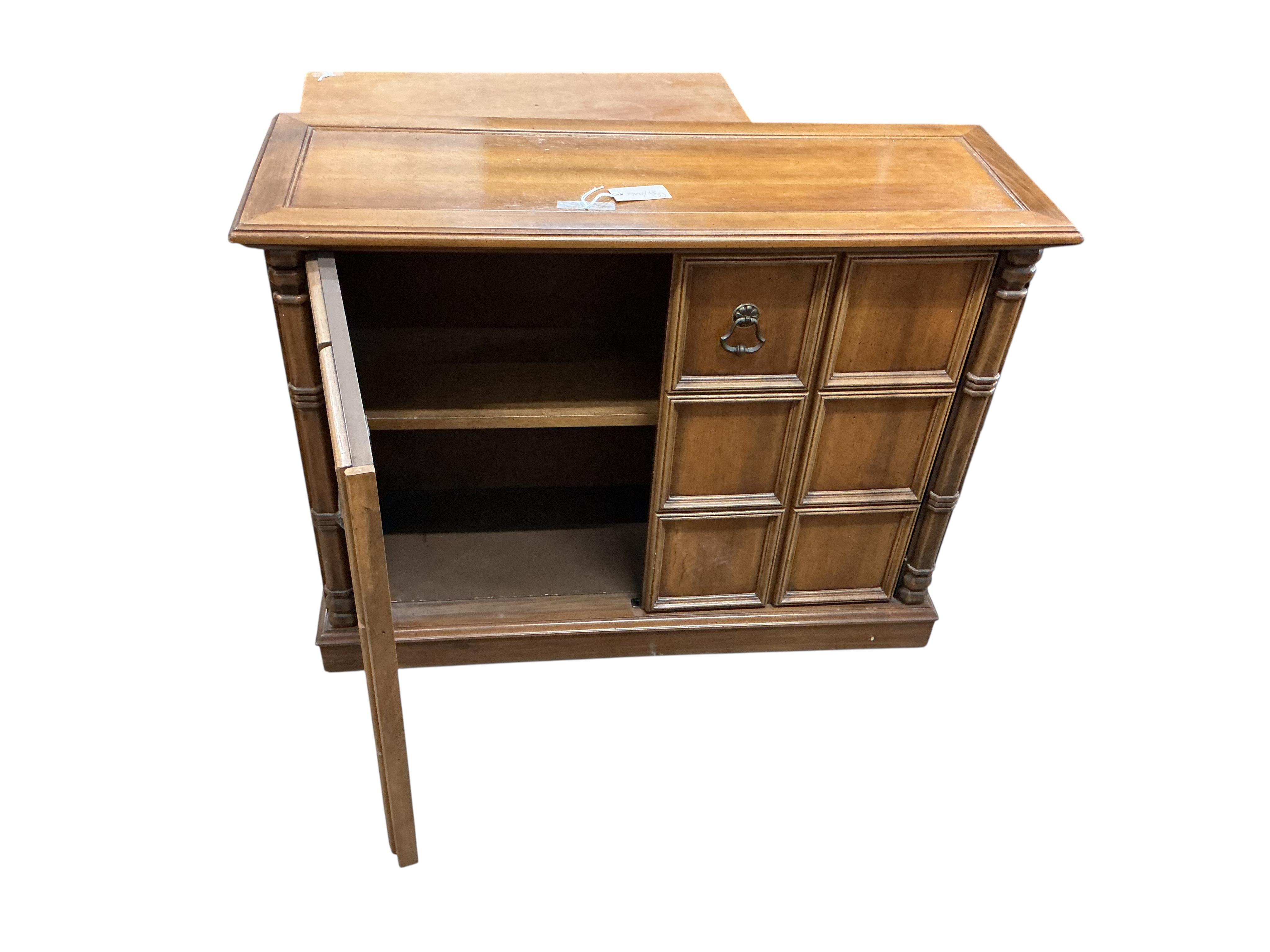 A reproduction square inlaid yew revolving bookcase, width 45cm, height 85cm, together with a reproduction Spanish style two door hardwood cabinet
